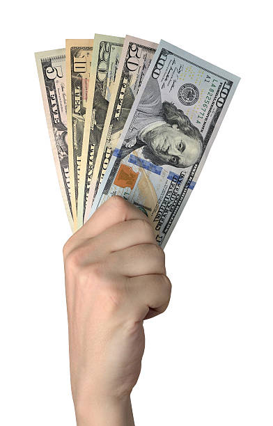 Hand holding of Dollar Bills. Isolated on white background stock photo