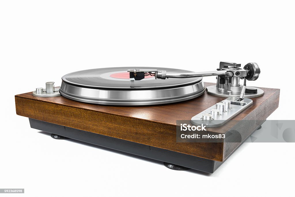 Turntable with vinyl record on white background Turntable with vinyl record isolated on white background with clipping path Turntable Stock Photo