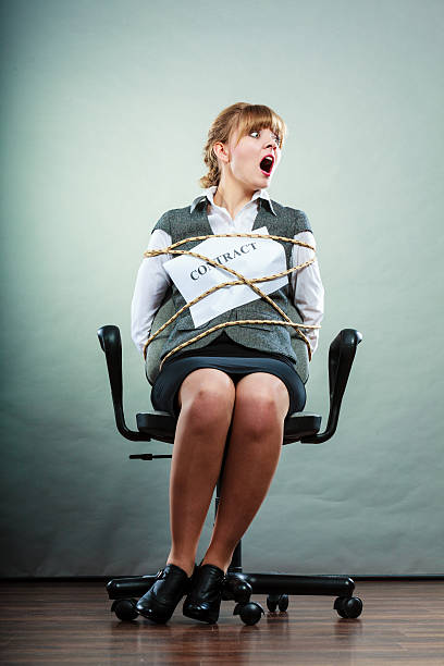 istock Afraid businesswoman bound by contract terms. 592370400