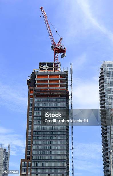 Crane At Construction Site Of New Commercial Building Stock Photo - Download Image Now