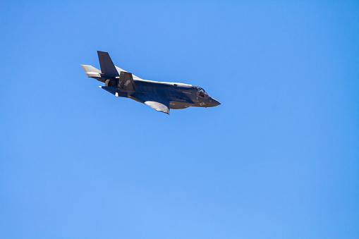Miramar, USA- October 4, 2014: Lockheed Martin F-35 Lightning II aircraft at airshow. F-35 lightning, Marine jet fighter, during the 2014 Miramar Air Show. The 2014 Miramar Air Show, free to the public,features US Military aircraft and civilian acrobatic flying. On this day the Marines were showcasing the F-35 to a crowd of about 20,000. The plane was showcase before been battle tested and at the time only the Marines had access to this plane.