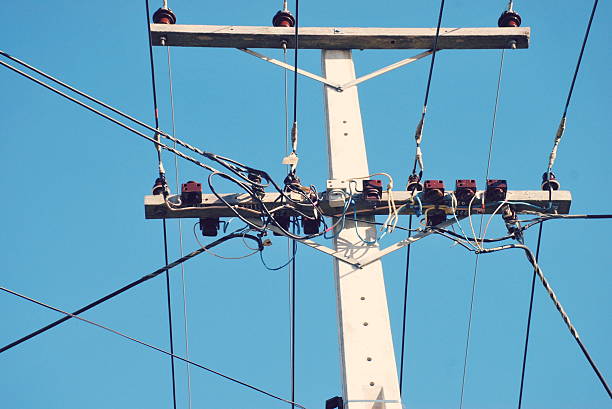A close-up upward view of a New Zealand Power Line.