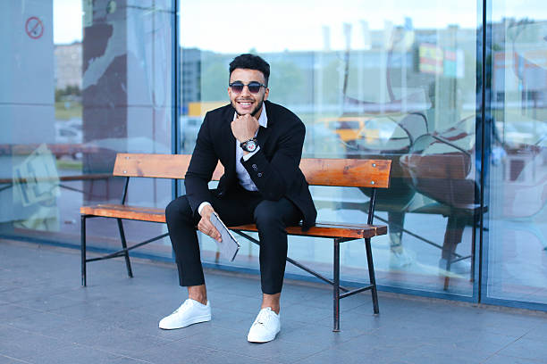 istock Man in suit arabic puts on sunglasses with tablet near 592378894