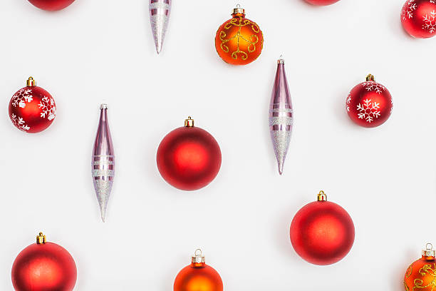istock red christmas balls and glass icicles on white 592380648