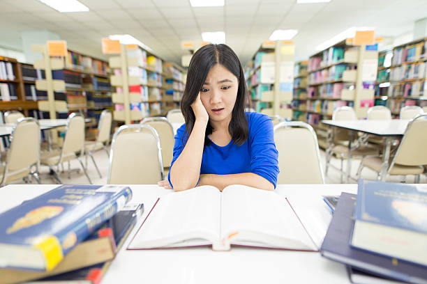 istock Crazy woman in the library 592381094