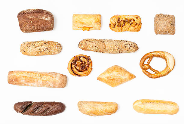 istock various fresh buns and loaves on white background 592381550