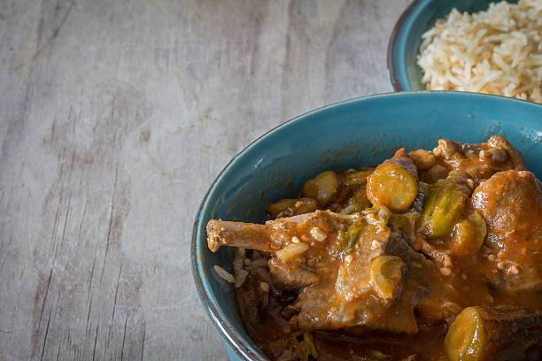 istock Bowl of Bamiya with Rice on Table 592383304