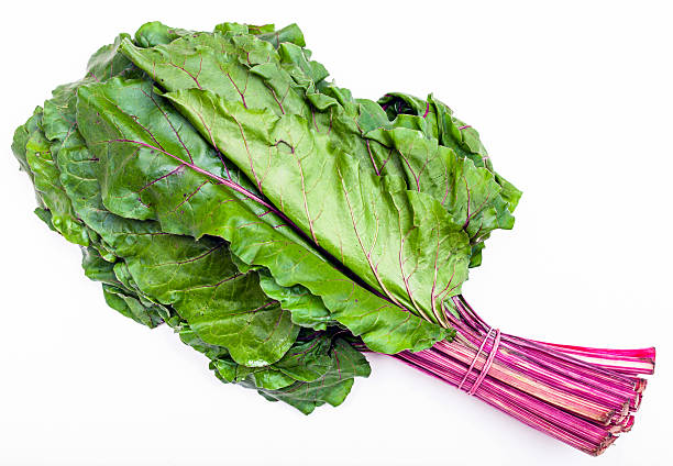 istock bunch of fresh cut beet greens on white 592386964