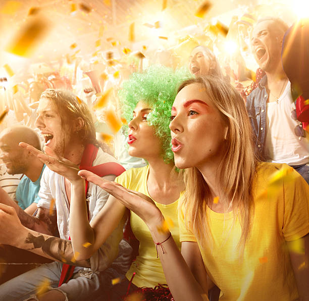 istock Sport fans: Two female friends send a kiss 592387442
