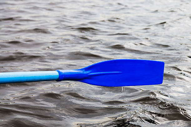 oar blade over the water during rowing boat on lake