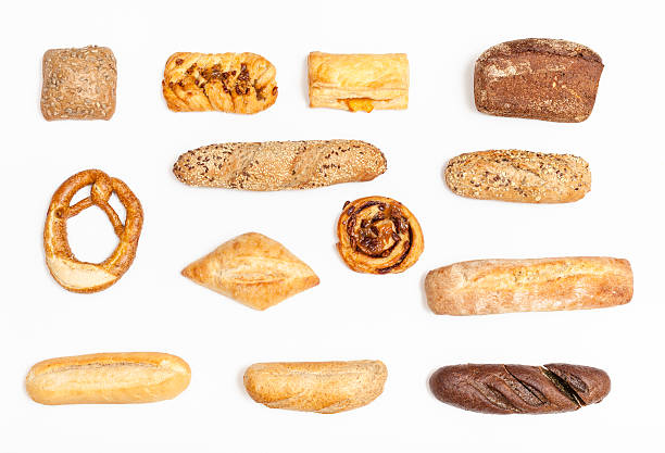 istock various freshly baked buns and loaves on white 592387750