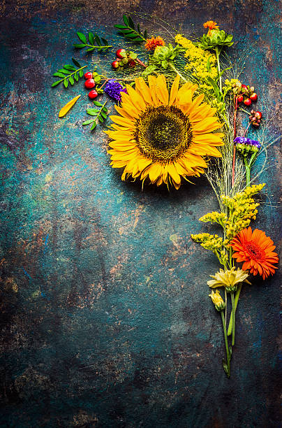 istock Autumn flowers bunch with sunflowers , top view, frame 592390098