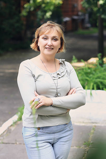 istock Beautiful woman is in the park. 592391438