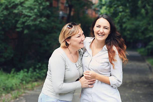 caucasian mother and daughter together in the park