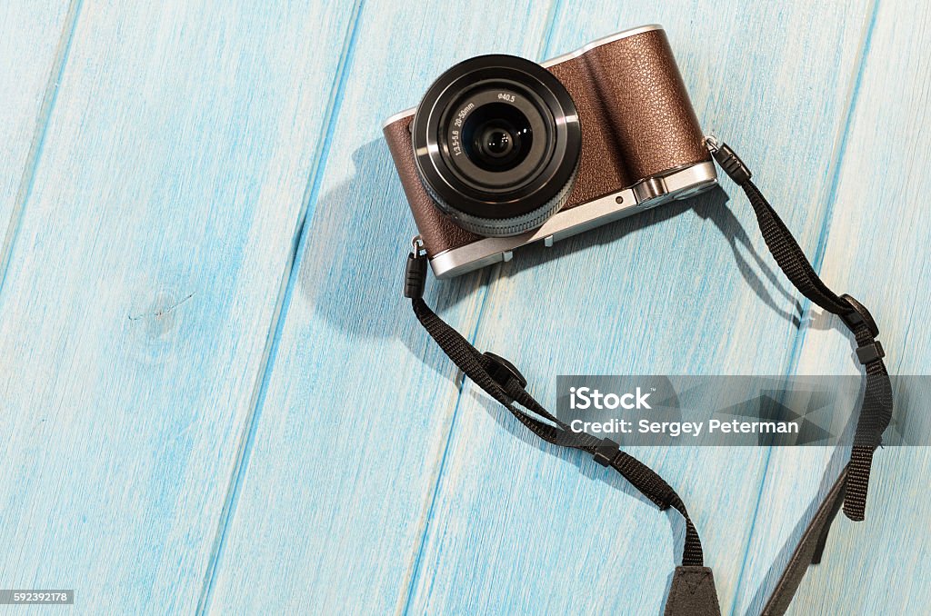 retro style camera top view of retro style camera on blue wooden table Abstract Stock Photo