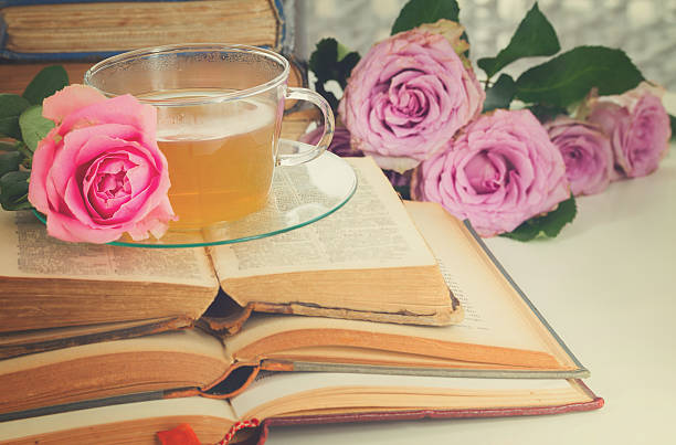 istock Cup of tea with books 592393642