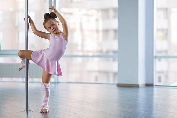 istock Adorable girl dancer in the ballet studio 592393896
