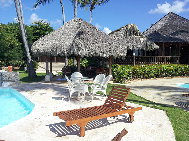 istock Lounge Chair and pool 592393966