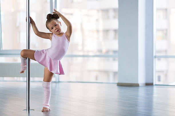 istock Adorable girl dancer in the ballet studio 592393968