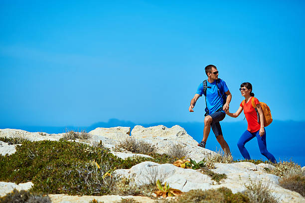istock travelers with backpacks 592395476