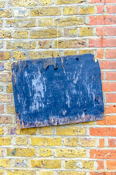 istock Abstract painted wooden board on colorful brickwall 592396616