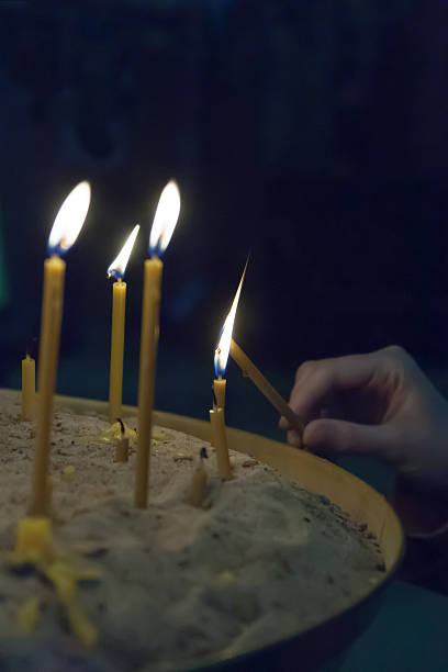 istock the lit candles in church against 592397690