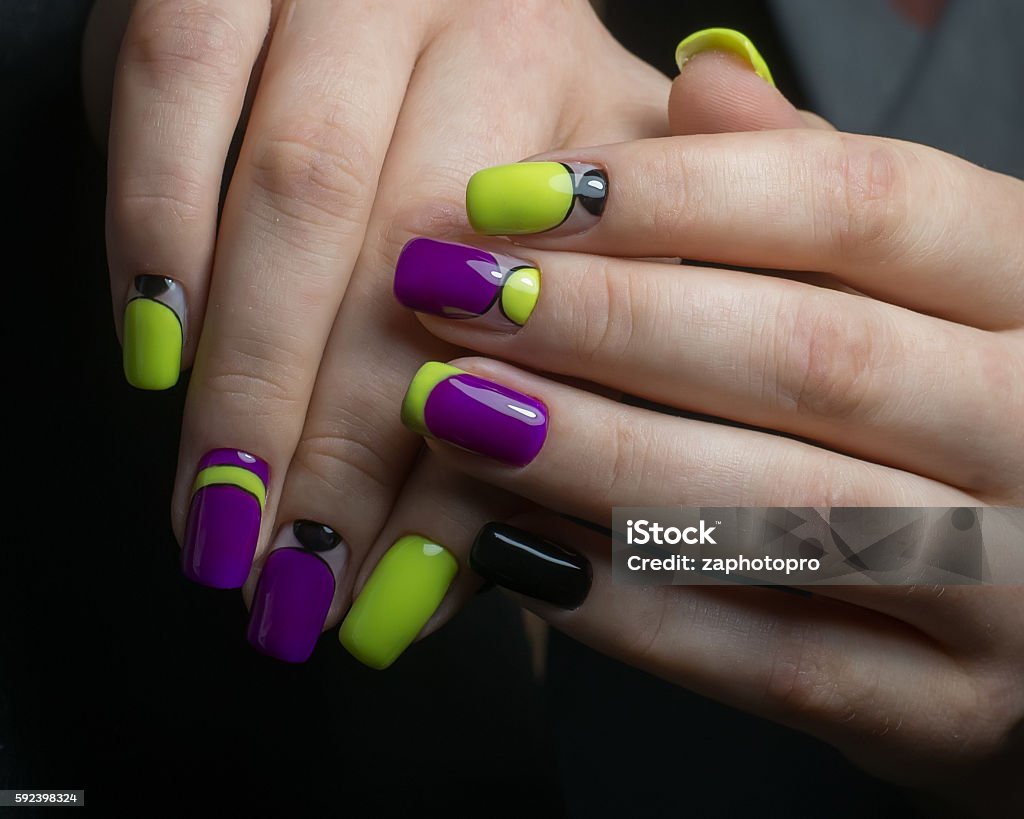 Trendy nail art half moon geometric Trendy violet yellow nail art half moon geometric  Manicure Stock Photo