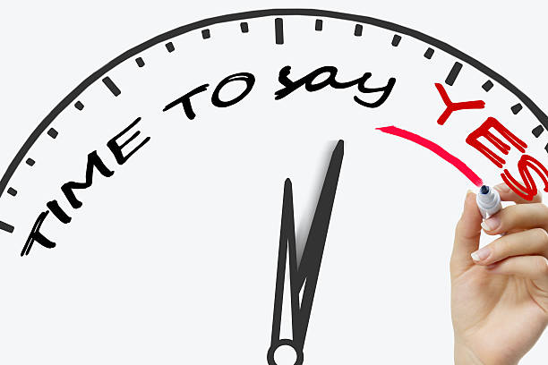 istock Hand writing time to say yes.  concept with red marker 592402782