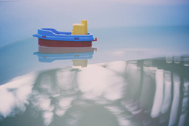 istock Toy boat in the pool 592402814