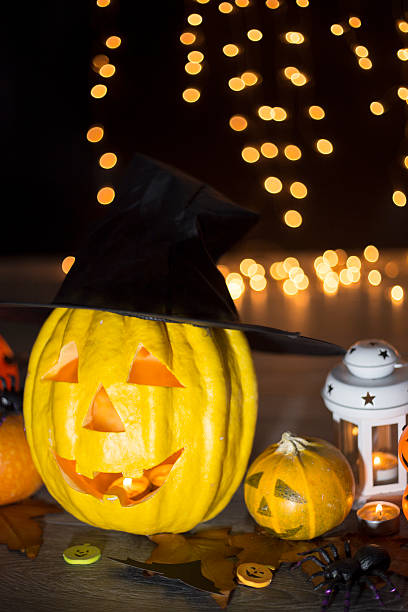 istock Halloween pumpkin head jack lantern on wooden background 592403042