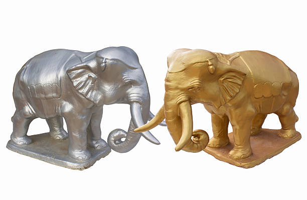 istock golden and silver elephant standing in front Shrine of Thailand 592403128