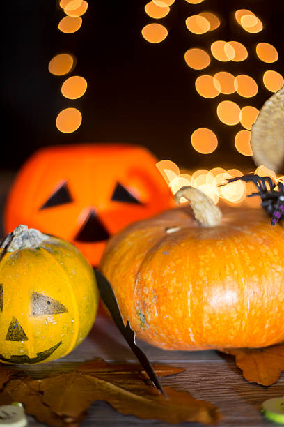 istock Halloween pumpkin head jack lantern on wooden background 592403374