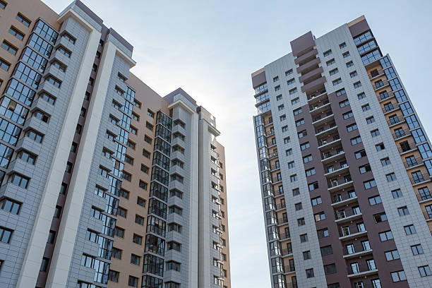 istock high-rise an apartment building on the sky background 592404284