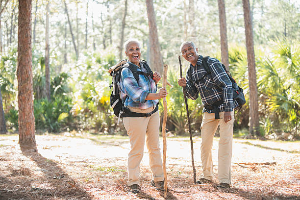 istock African American seniors hiking through woods 592405318