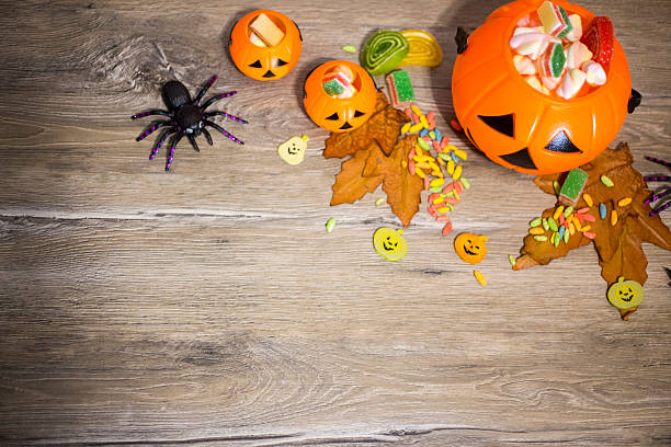 istock Halloween Jack o Lantern pail overflowing with candy 592405436