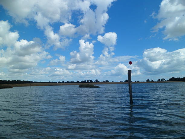 istock Navigation pole on the Blyth River Estuary, Suffolk 592407568