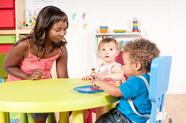 istock Toddlers Eating in the Nursery 592408408