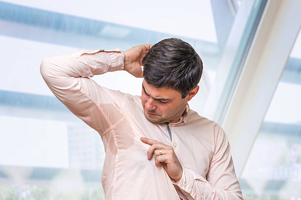 istock Business man with sweating under armpit in office 592408832