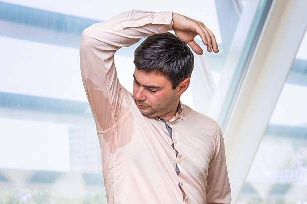 istock Business man with sweating under armpit in office 592408858