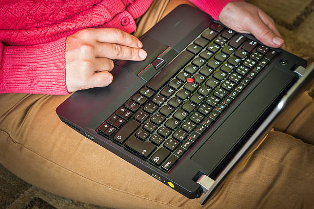 Woman sitting on the floor with laptop