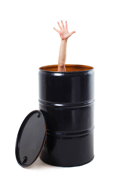 man's hand poked out of the black cask