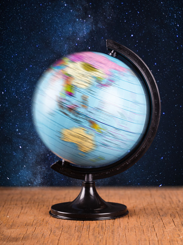 spinning globe on the background of night sky