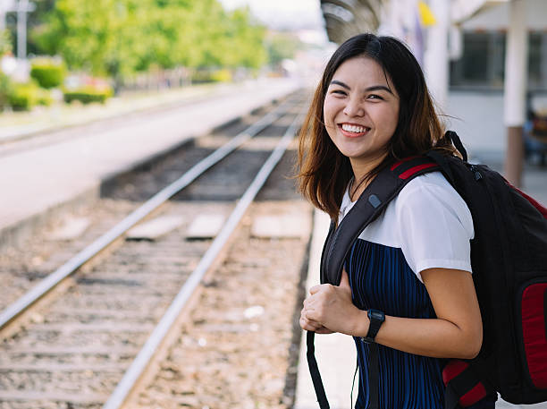 istock little girl waiting for the train 592647140
