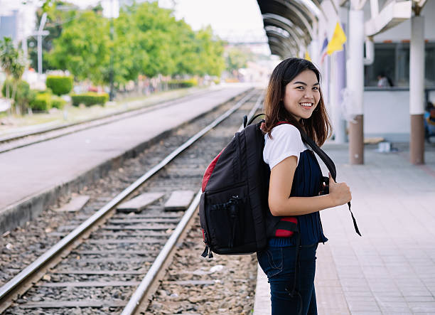 istock little girl waiting for the train 592647548