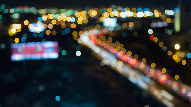 istock Nights lights, blurred bokeh highway road curved 592649998
