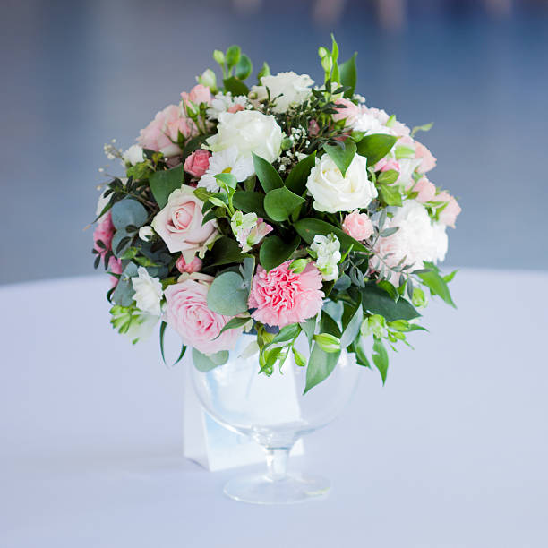 istock Wedding floristry. Beautiful lush bouquet on the table in restaurant 592650300
