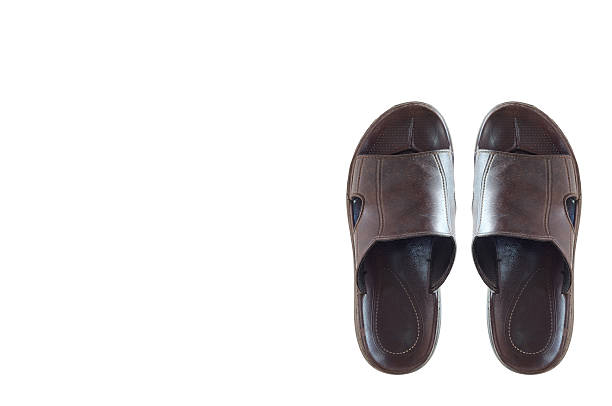 istock Pair of genuine leather slippers isolated on white background 592651608