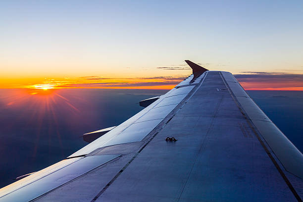 istock Wing of an airplane in the sunset 592653224