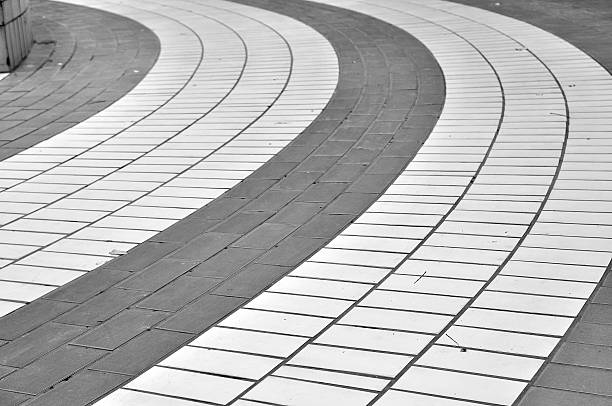 istock Curve walkway arrange by color brick. 592653836