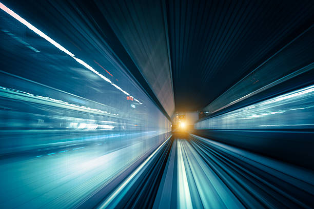 abstrakte geschwindigkeit bewegung im eisenbahntunnel - blurred motion abstract electricity power line stock-fotos und bilder